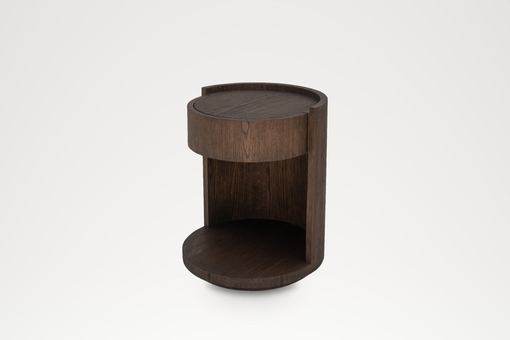 Round oak bedside table, angled view of the open shelf and recessed plinth base
