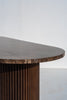 Emperador Dark marble top and fluted solid walnut pedestal of the Livia dining table