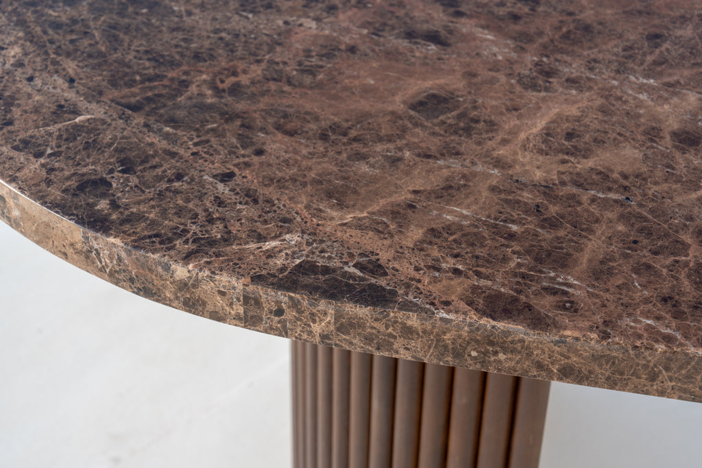 Close-up of Livia brown Emperador marble top and reeded walnut pedestal