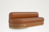 Custom leather banquette with curved wood base and polished brass kick plate – made in Dubai
