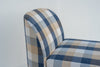 Close-up of the rounded upholstered arm and linen-blend check fabric on the Nantucket bench