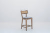 Kitchen island bar chair in oak and natural cane with an oatmeal linen cushion