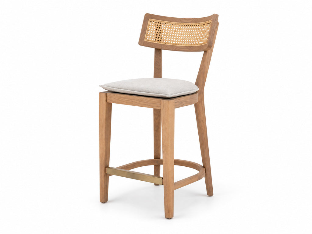 Ojai oak and cane counter stool on a white background, three-quarter view with brass footrest