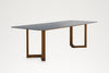 Pietra dining table, long-side angled view, seats eight to ten