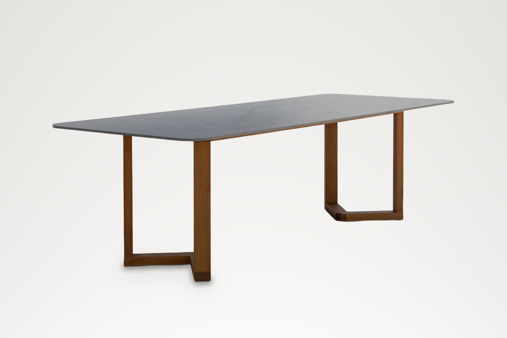 Pietra dining table, long-side angled view, seats eight to ten