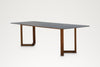 Pietra sintered stone dining table with solid teak legs made in Dubai, three-quarter view