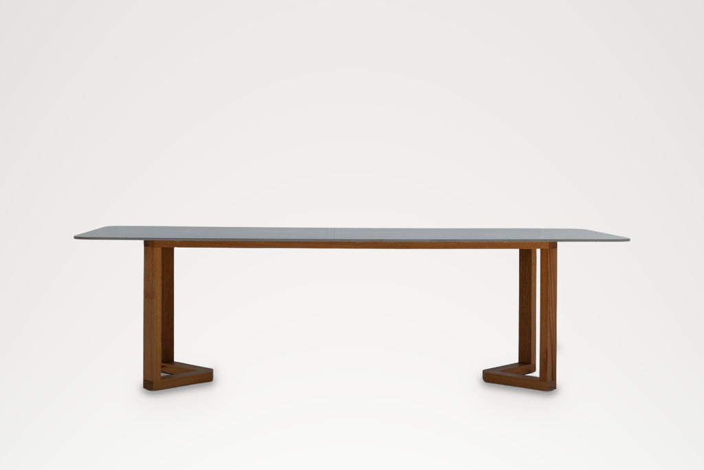 Pietra dining table with grey stone top and teak legs, front view – outdoor dining table Dubai