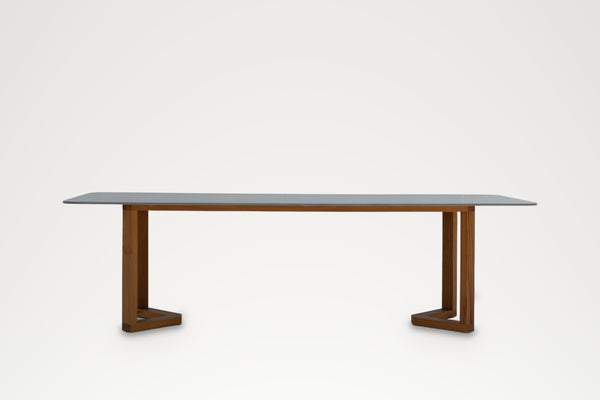 Pietra dining table with grey stone top and teak legs, front view – outdoor dining table Dubai