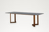 Stone and teak dining table for indoor and outdoor use, three-quarter view