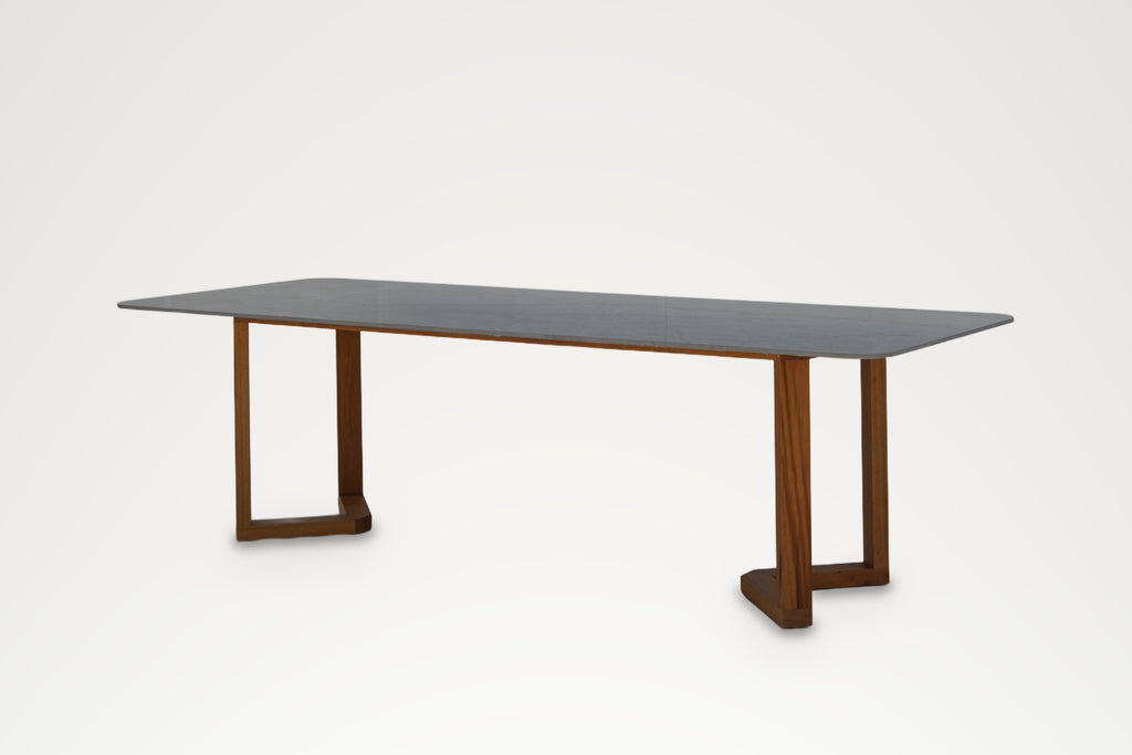 Stone and teak dining table for indoor and outdoor use, three-quarter view