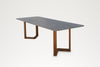 Grey sintered stone top with white veining on the Pietra dining table, seen from above