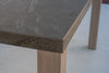 Pietra outdoor bar table stone top meeting a solid teak leg, joint detail