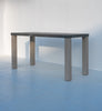 Pietra outdoor bar table, dark stone top on square teak legs, angled view