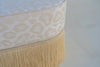 Cream bullion fringe and jacquard upholstery detail on the Savannah storage bench