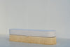 Savannah upholstered bench with storage, three-quarter view with rounded racetrack ends