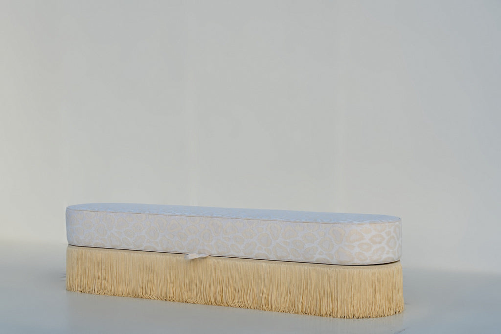 Savannah upholstered bench with storage, three-quarter view with rounded racetrack ends
